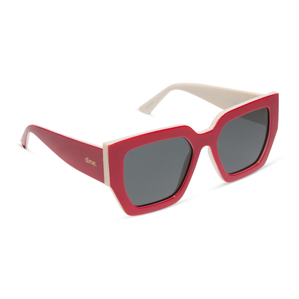 dime optics highland square sunglasses with a ruby red frame and swiss coffee grey polarized lenses angled view