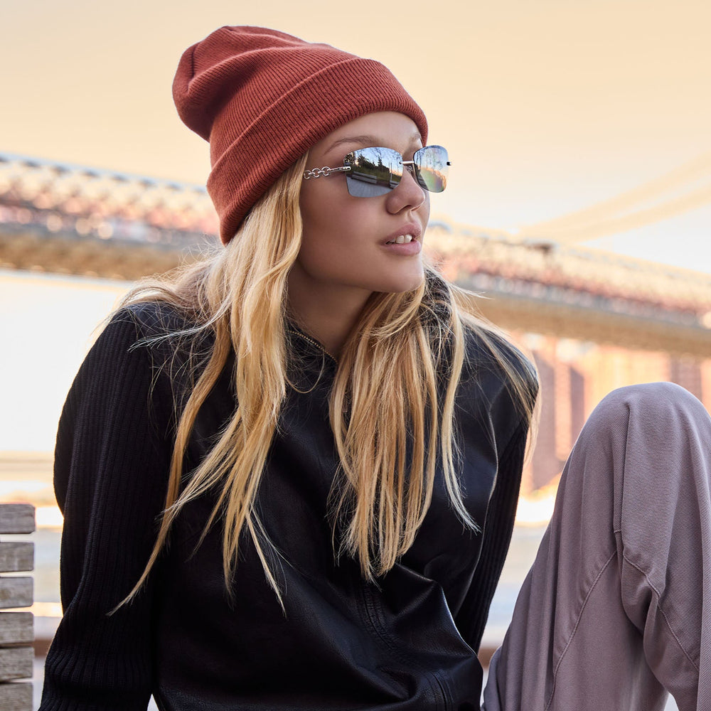 on model - blonde female wearing alondra dessy x dime optics featuring a vibe square sunglasses with a silver frame and silver mirror lenses side view