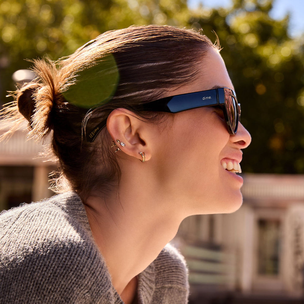 on model - les do makeup x dime optics featuring last call cat eye sunglasses with a black frame and grey polarized lenses side view