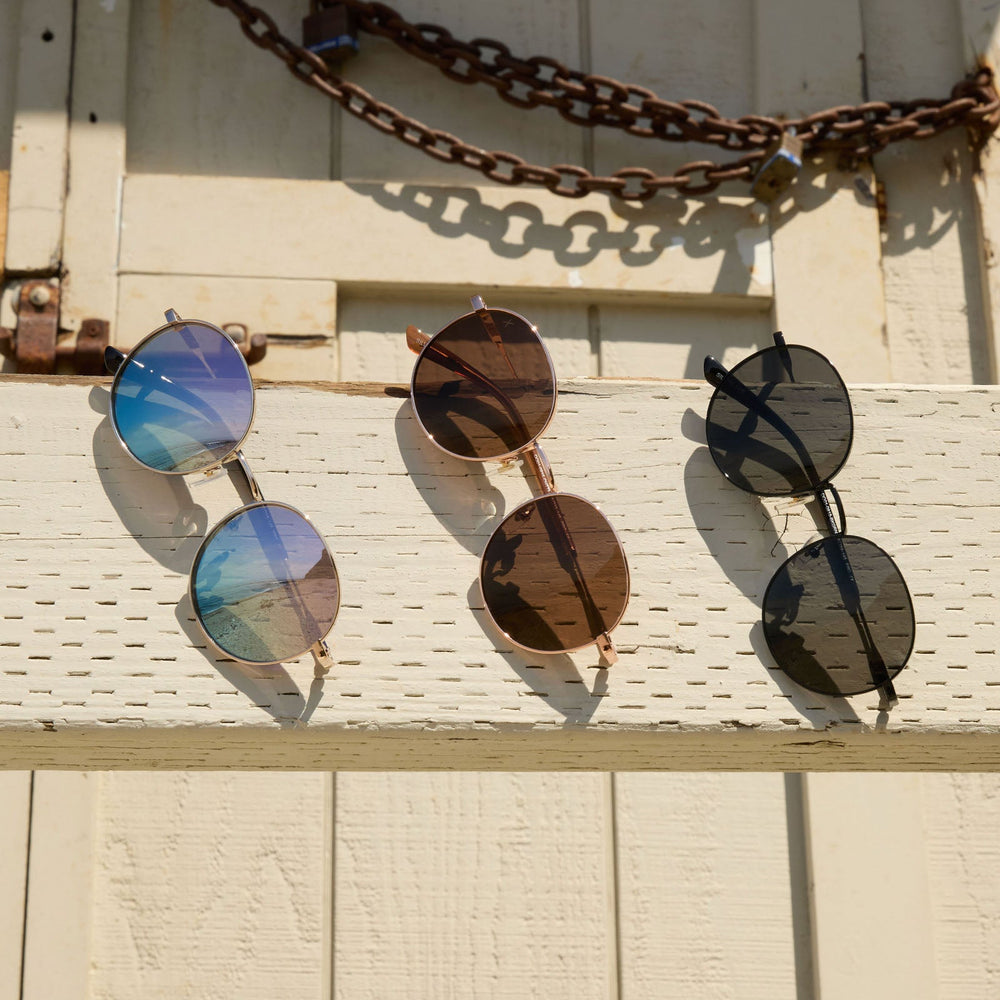 group shot of dime optics silverlake sunglasses hanging on a life guard tower
