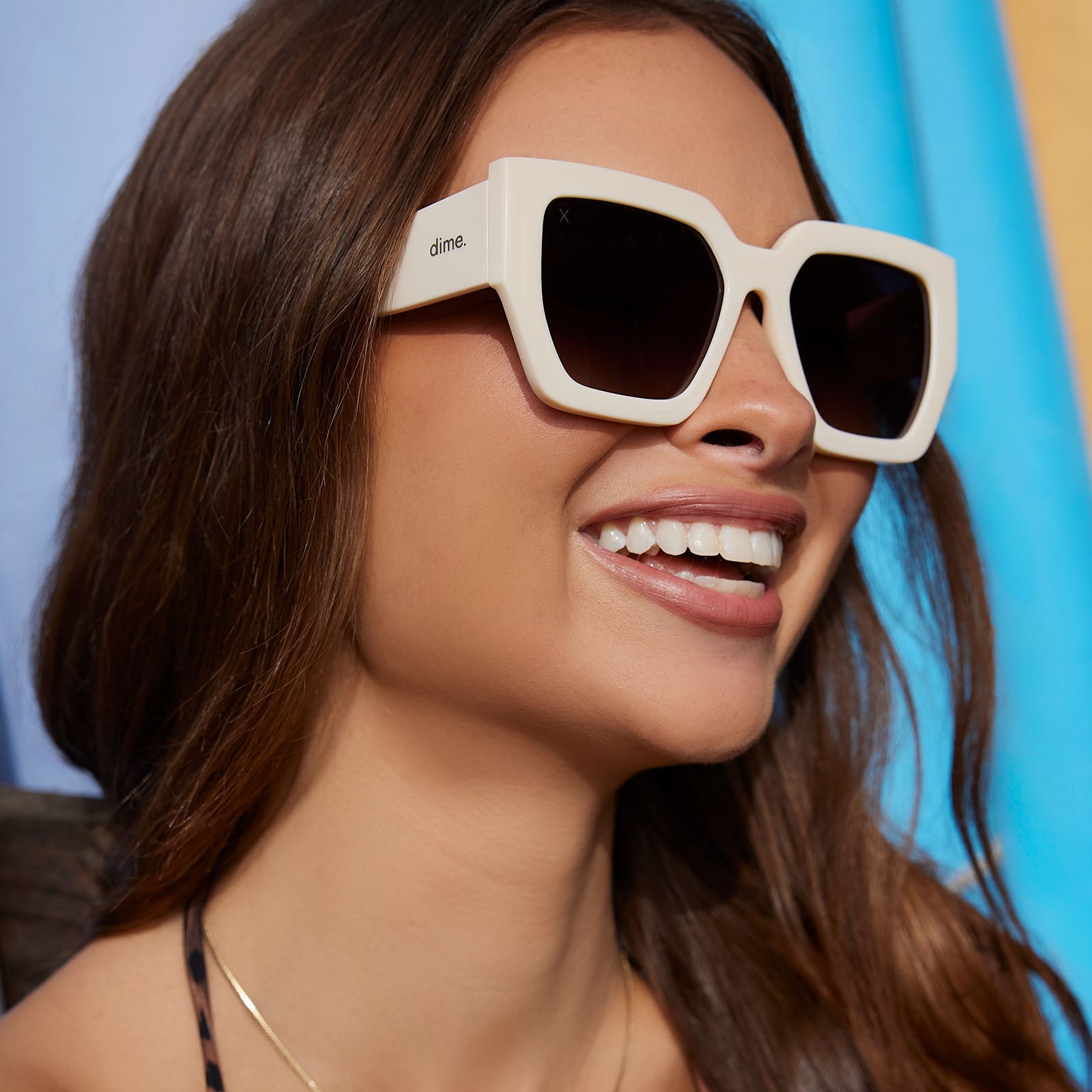 on model - female wearing dime optics highland square sunglasses with a swiss coffee cream frame and brown gradient polarized lenses angled view