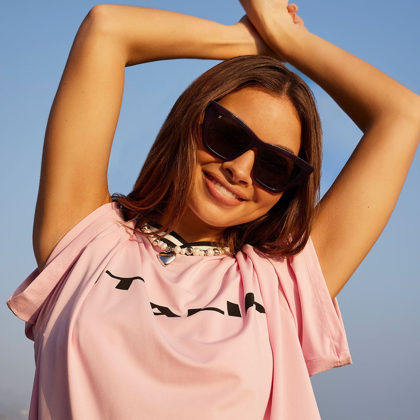 on model - female wearing dime optics featuring the windsor cat eye sunglasses with a amethyst purple frame and grey polarized lenses front view