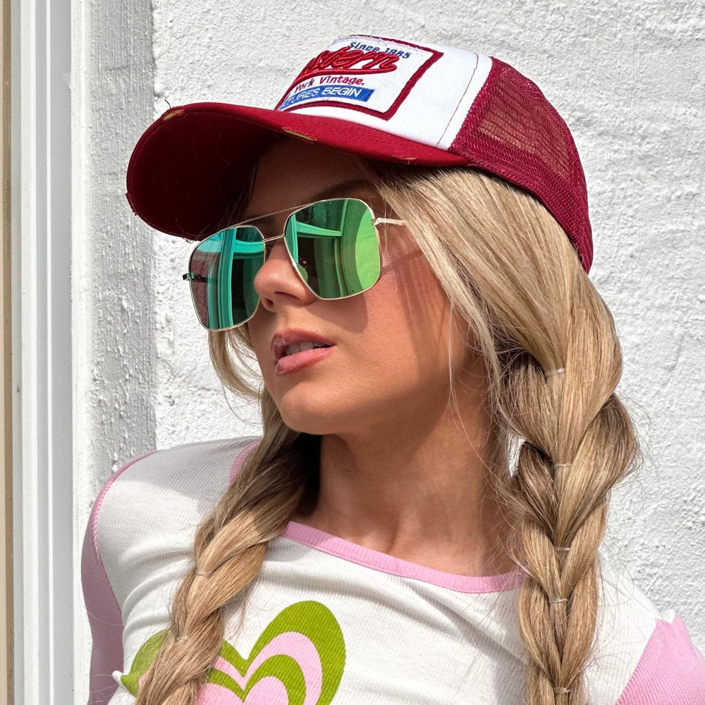 customer content - mariel higgs wearing green reflective aviators outside front view