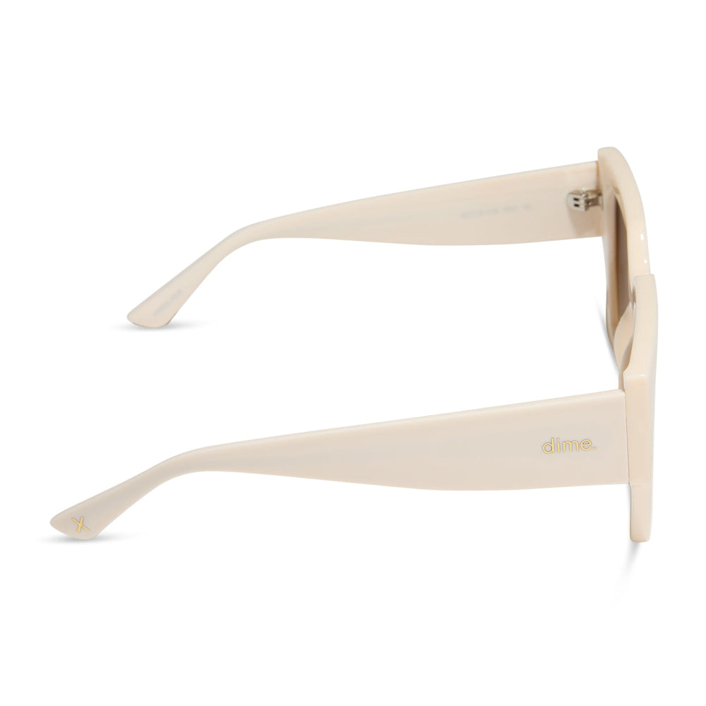 dime optics highland square sunglasses with a swiss coffee cream frame and brown gradient polarized lenses side view