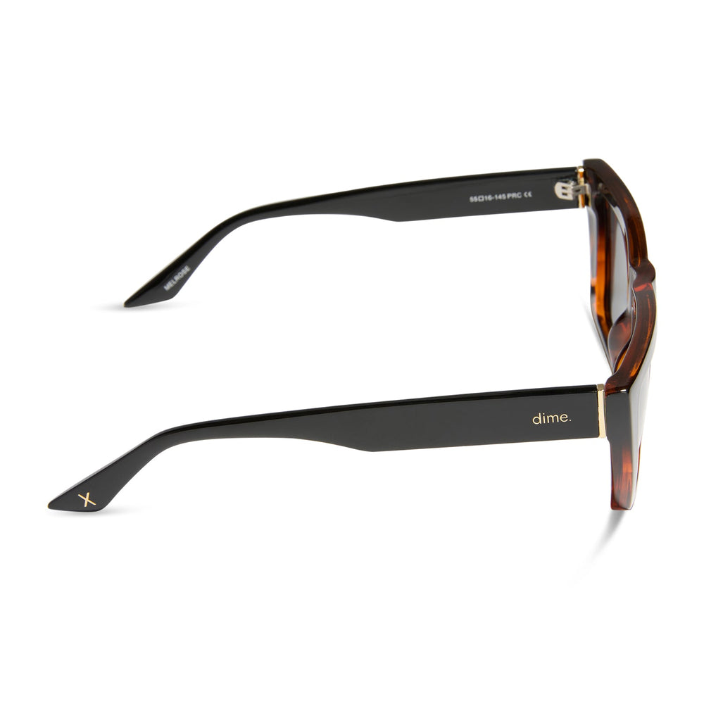 dime optics melrose cat eye sunglasses with a black tortoise frame and solid grey lenses side view