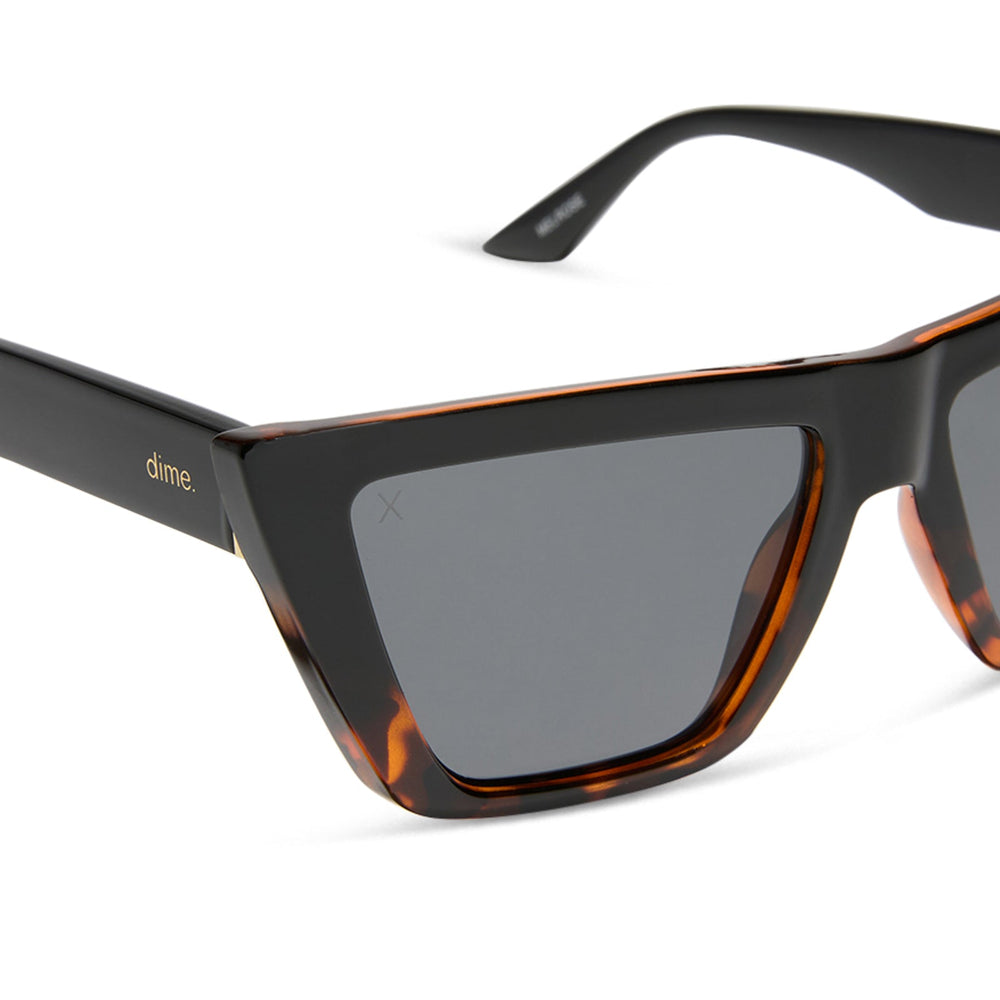 dime optics melrose cat eye sunglasses with a black tortoise frame and solid grey lenses detailed view