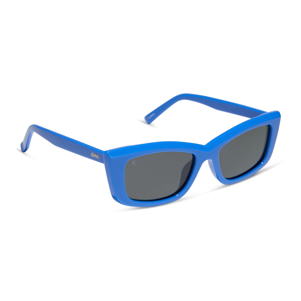 dime optics olympic cat eye sunglasses with a poolhouse blue frame and grey polarized lenses angled view