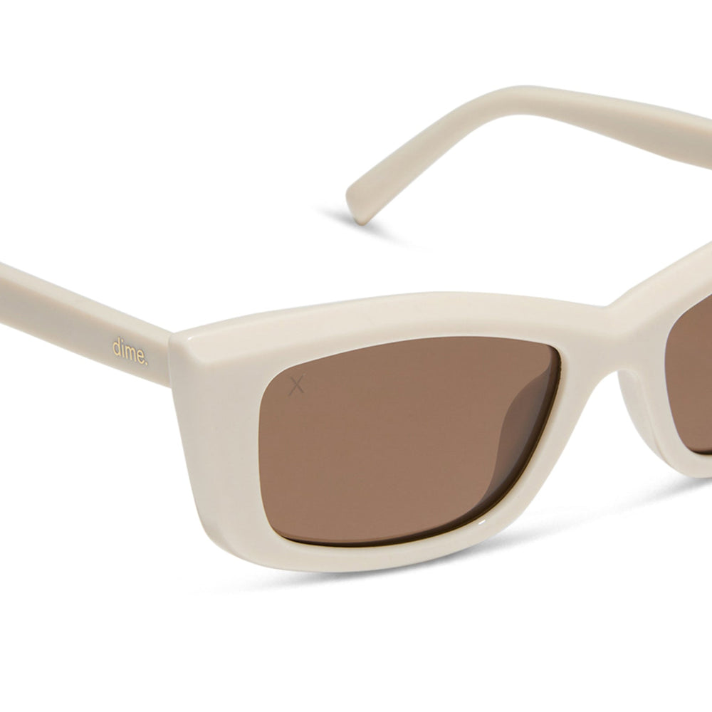 dime optics olympic cat eye sunglasses with a swiss coffee cream frame and brown polarized lenses detailed view