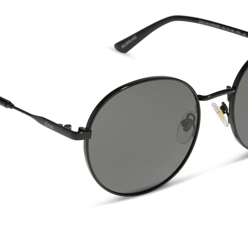 dime optics featuring the silverlake round sunglasses with a black frame and grey lenses detailed view