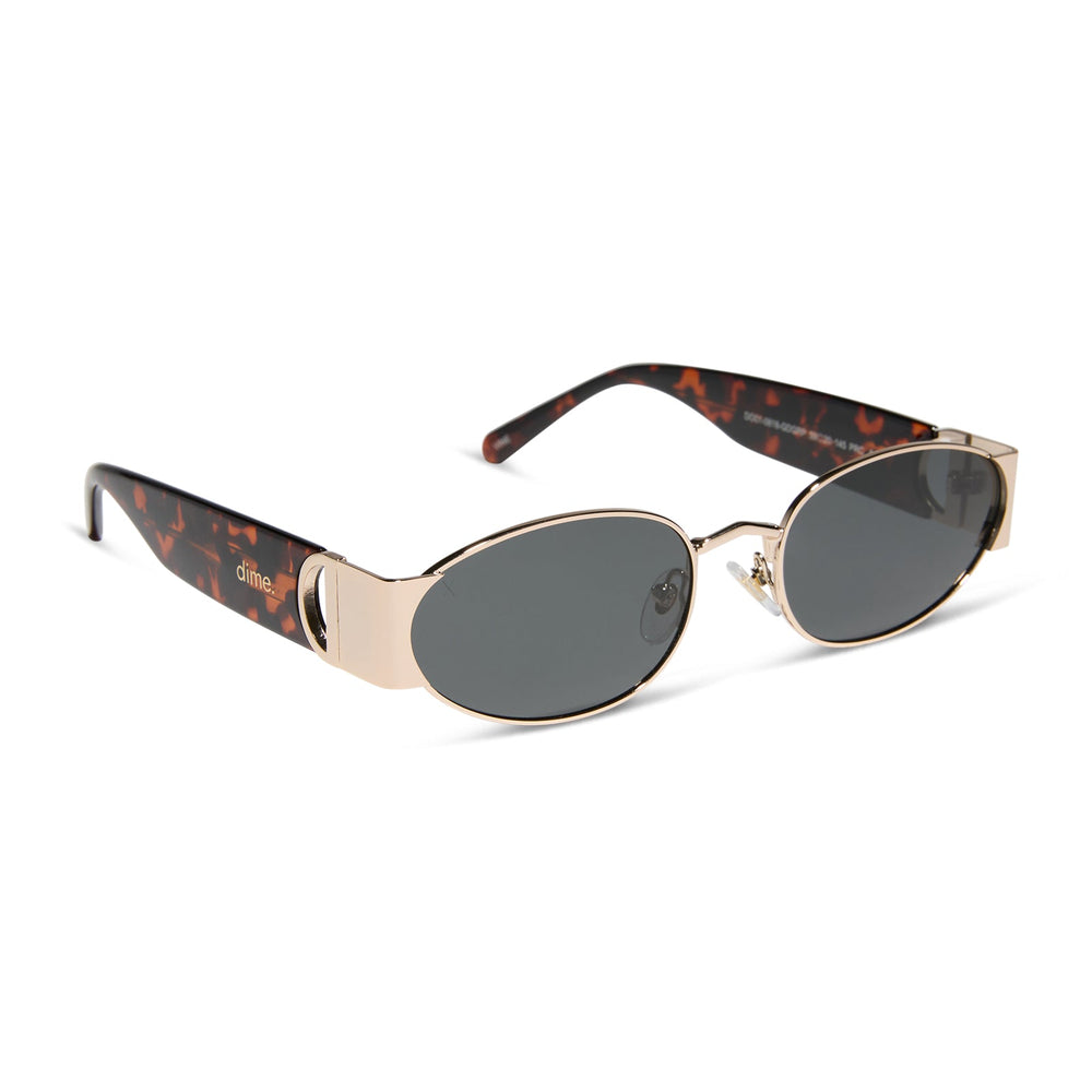 dime optics featuring the vine rectangular sunglasses with a gold and tortoise frame and grey lenses angled view