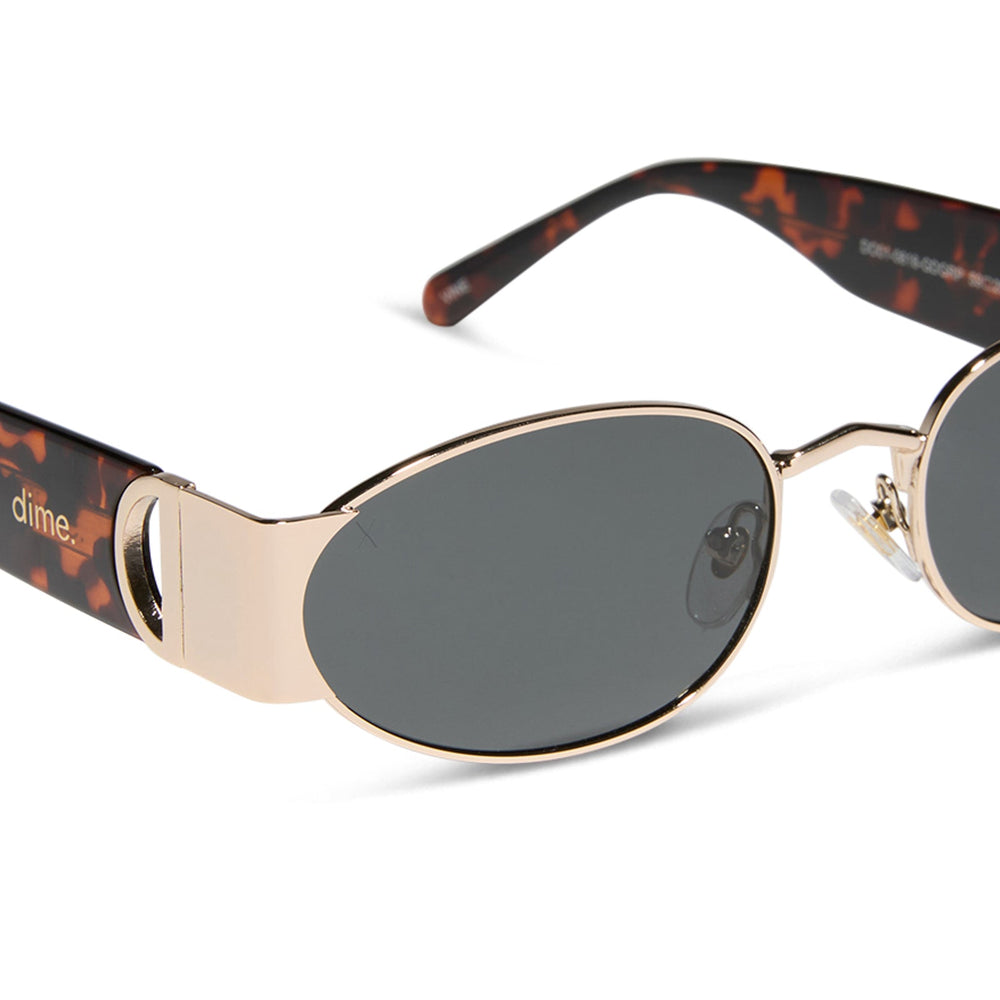 dime optics featuring the vine rectangular sunglasses with a gold and tortoise frame and grey lenses detailed view