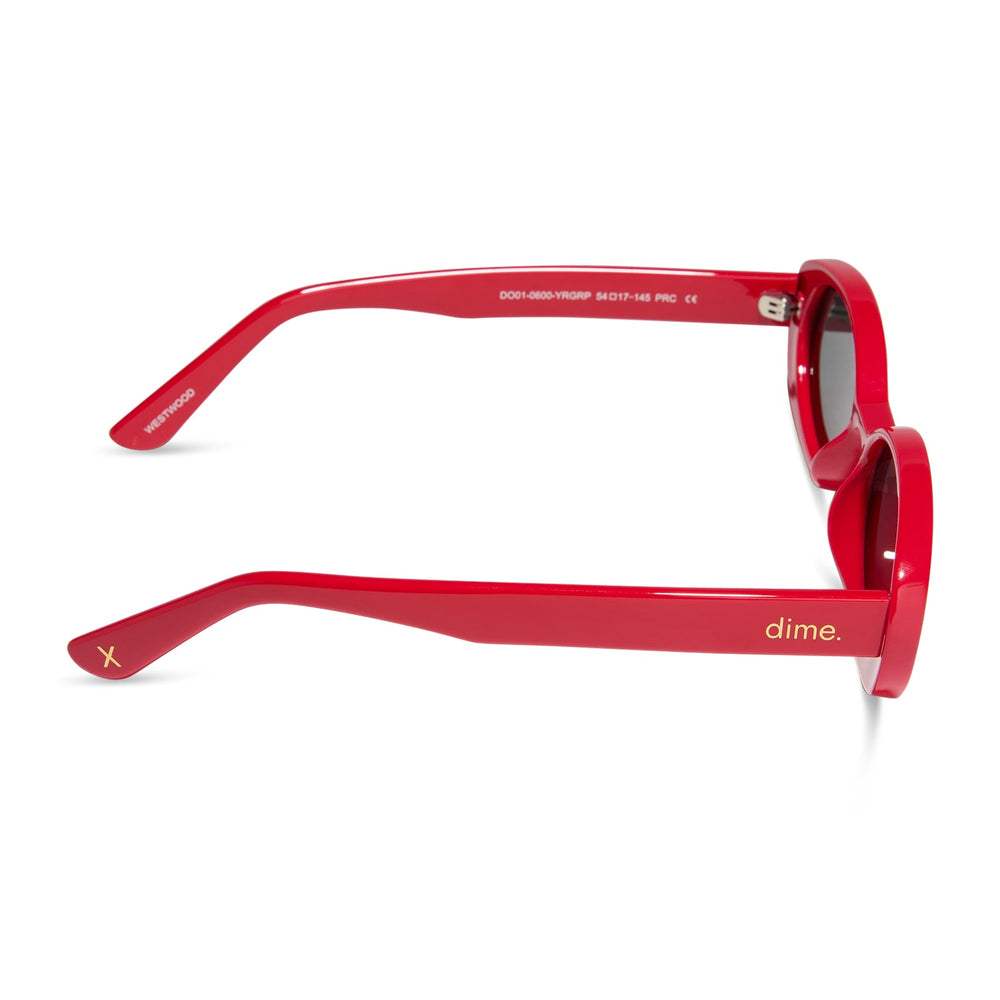 dime optics westwood round sunglasses with a ruby red frame and grey polarized lenses side view