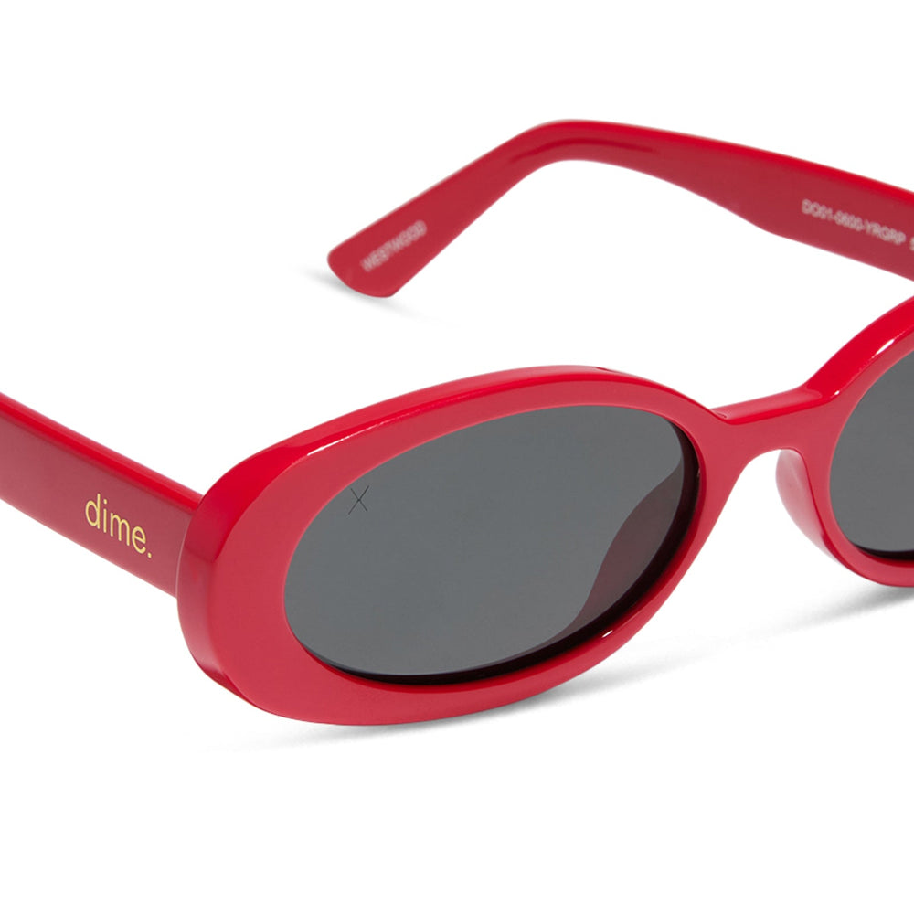 dime optics westwood round sunglasses with a ruby red frame and grey polarized lenses detailed view
