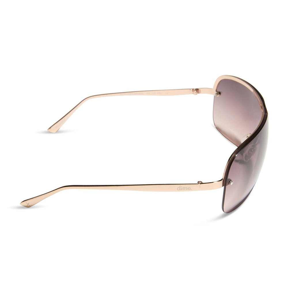 dime optics wilshire shield metal sunglasses with a brushed rose gold frame and rose gradient lenses side view
