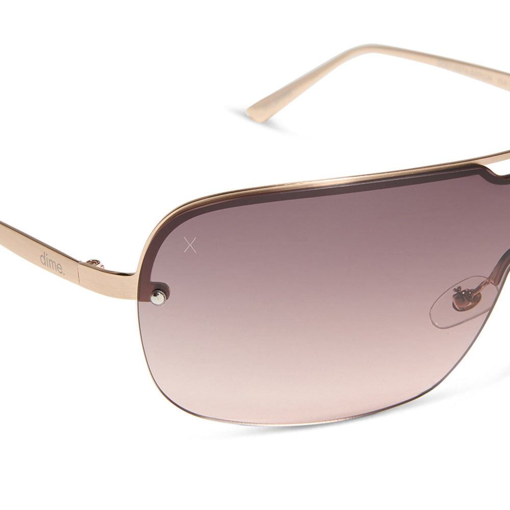 dime optics wilshire shield metal sunglasses with a brushed rose gold frame and rose gradient lenses detailed view