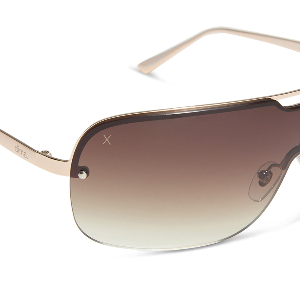 dime optics wilshire shield metal sunglasses with a shiny gold frame and brown gradient sharp lenses detailed view